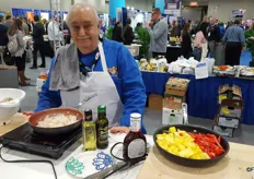 Chef Tony Merola cooking shrimp with red bell pepper and pineapple.